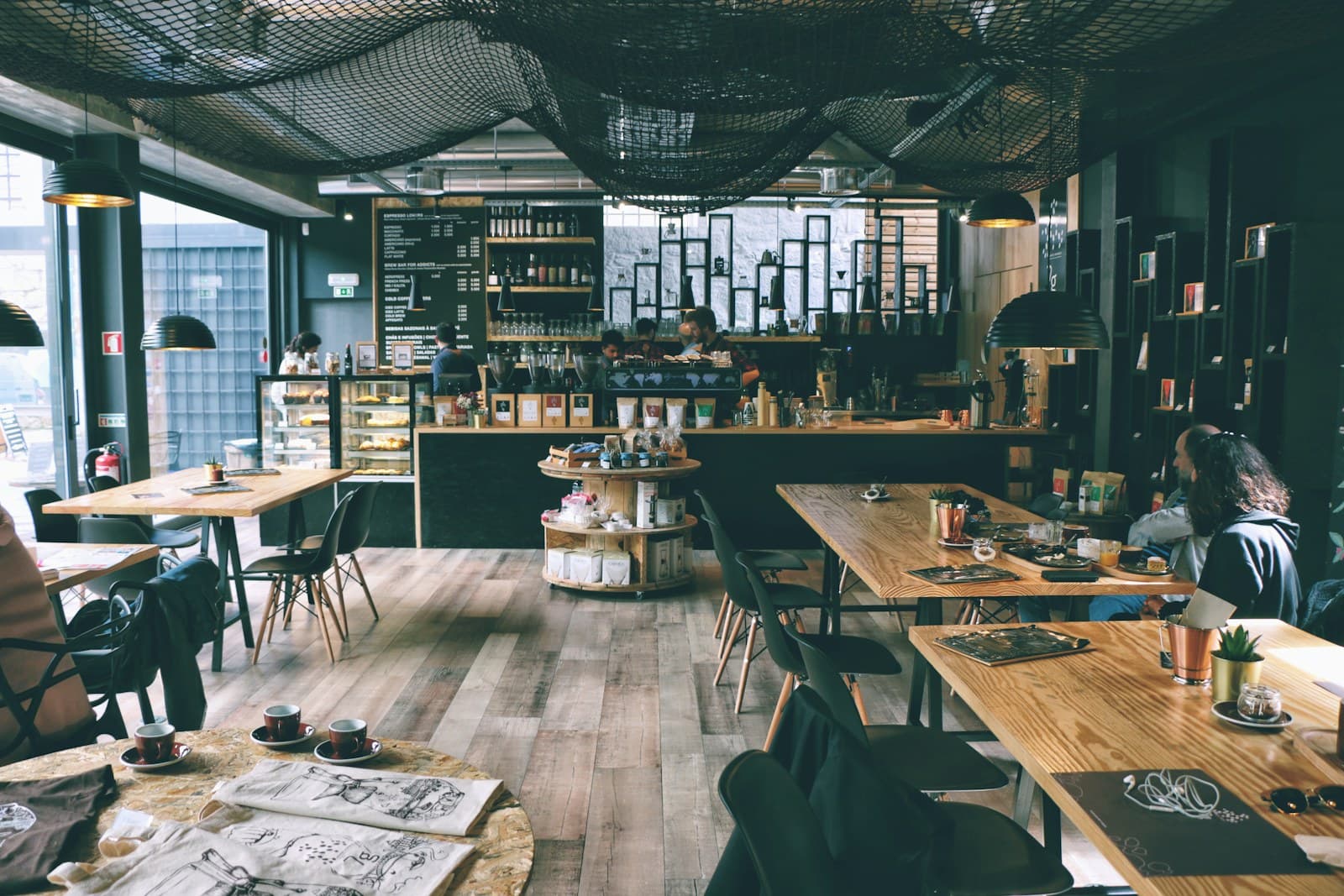 Customers seated at tables in a neighbourhood café